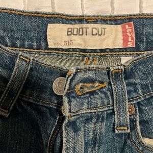 Levi’s boot cut low waisted jeans. Dark wash.